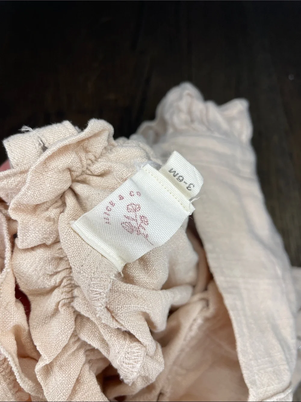 Beige Ruffled Infant Romper with Snap Closures